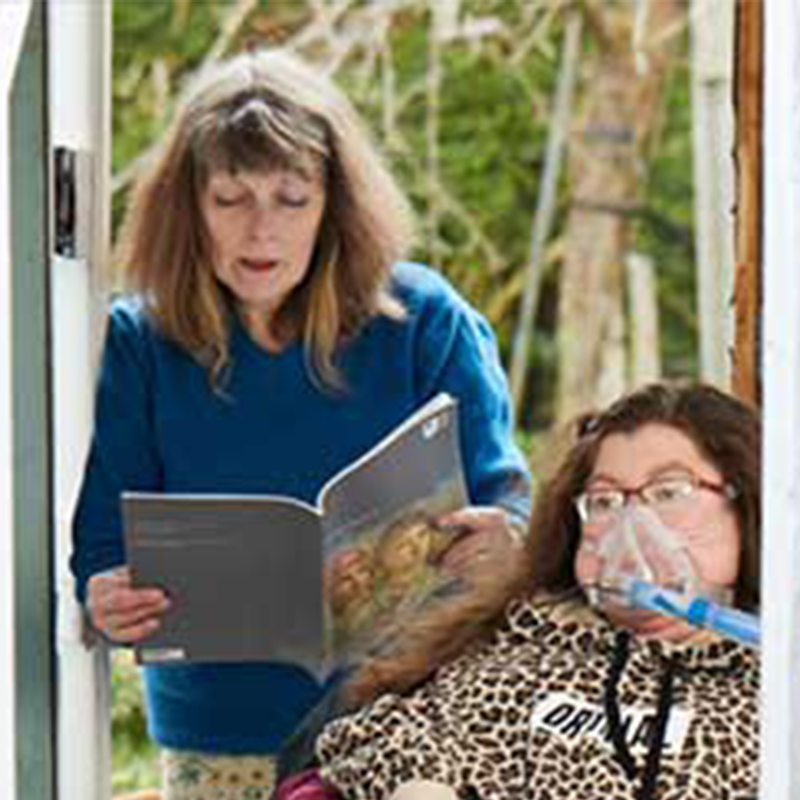 A disabled student with carer